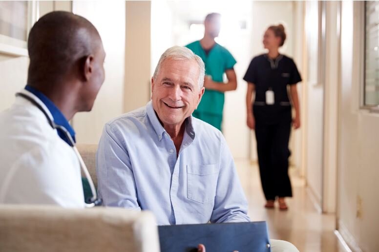 Primary care physician meeting with a patient at a regular doctor appointment