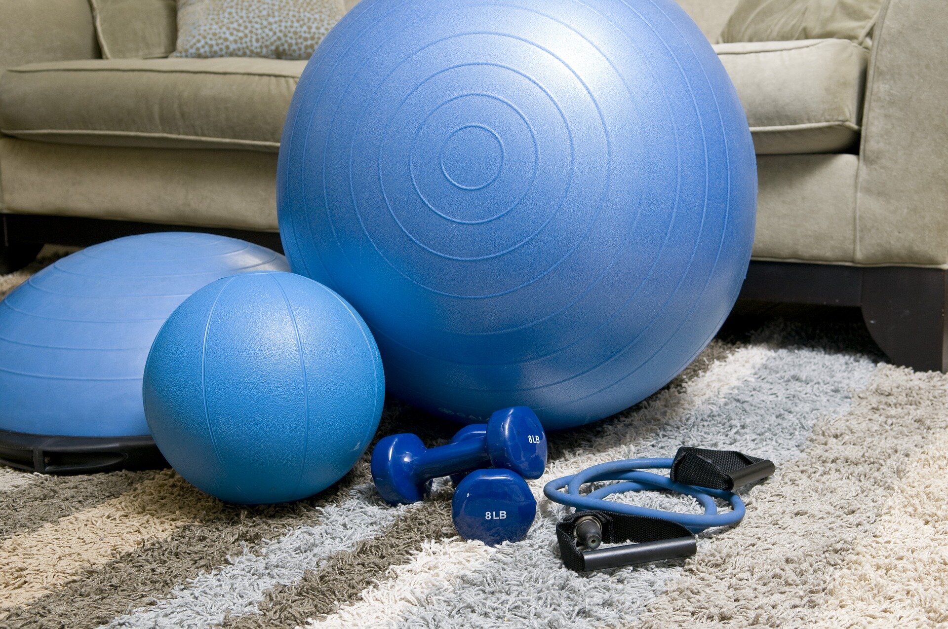 Blue exercise equipment on the living room floor