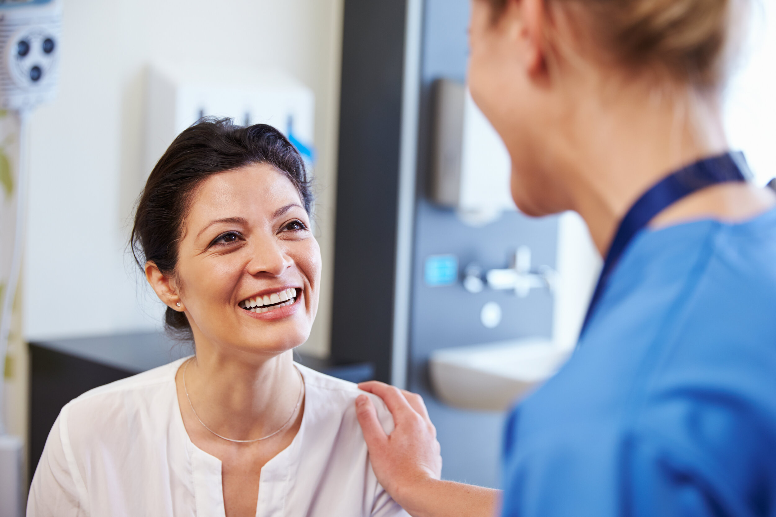 Female patient smiling at doctor